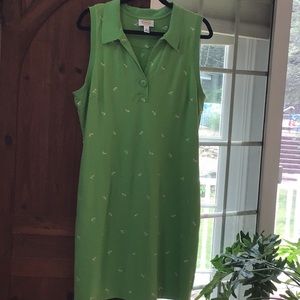 Lime green sleeveless dress with small yellow and blue embroidery.